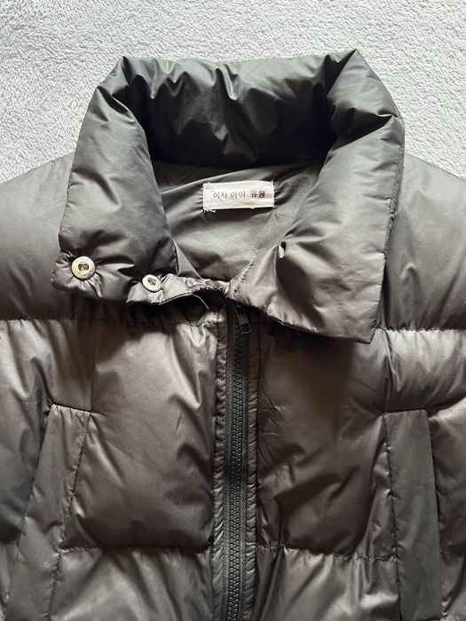 Жіноча чорна жилетка