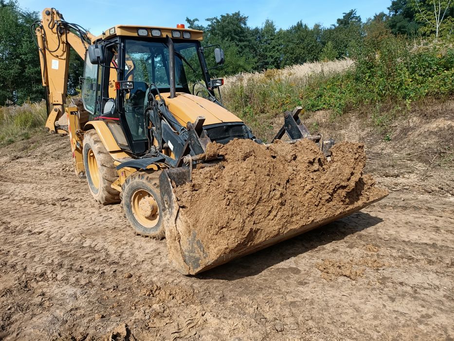 Transport, minikoparka, koparko ładowarka, kucie betonu, kostka brukow