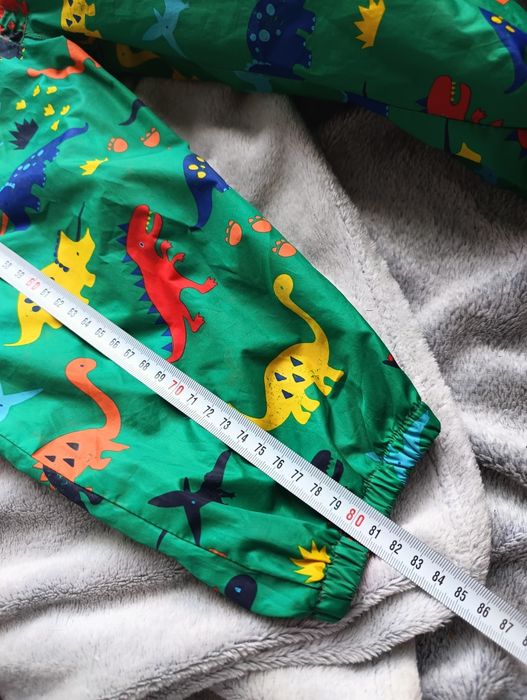 Kombinezon zielony w dinozaury na niepogodę 98/104
