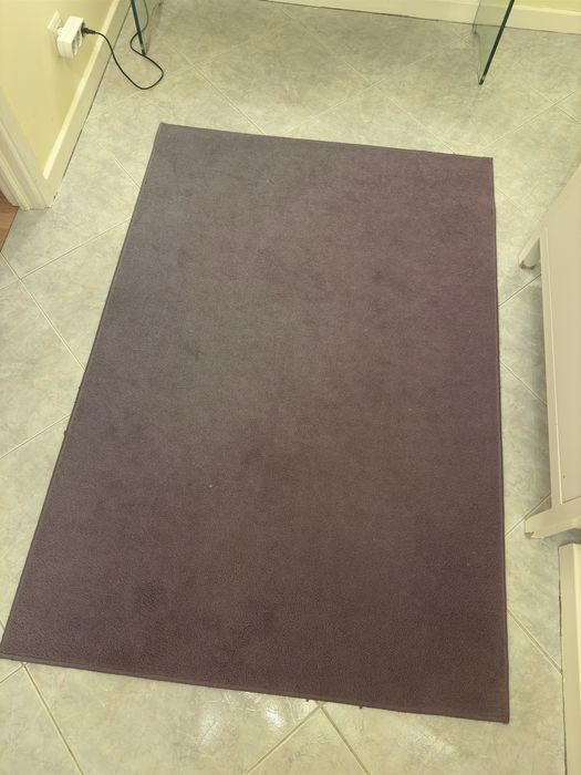 Purple rug with signs of use