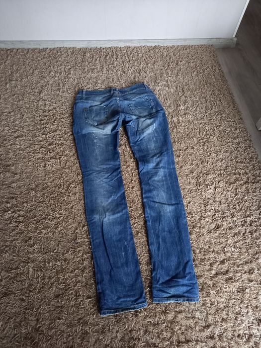 Jeansy spodnie z dziurami 28/34