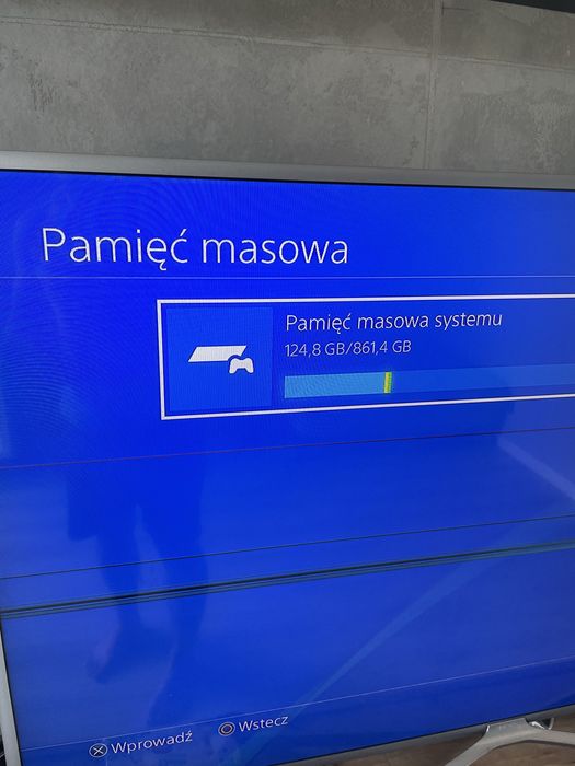 PlayStation 4 Slim 1TB + 2 pady + stacja ładująca + 2 gry + kamerka PS Eye