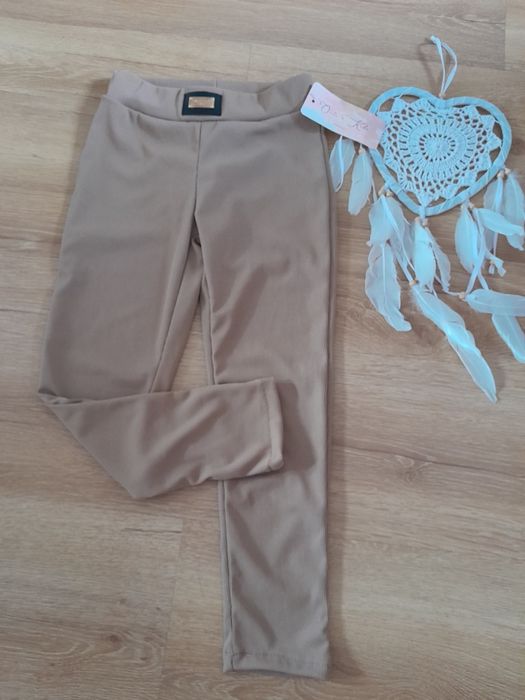 Brązowe prazkowane legginsy leginsy 12 lat 146 152