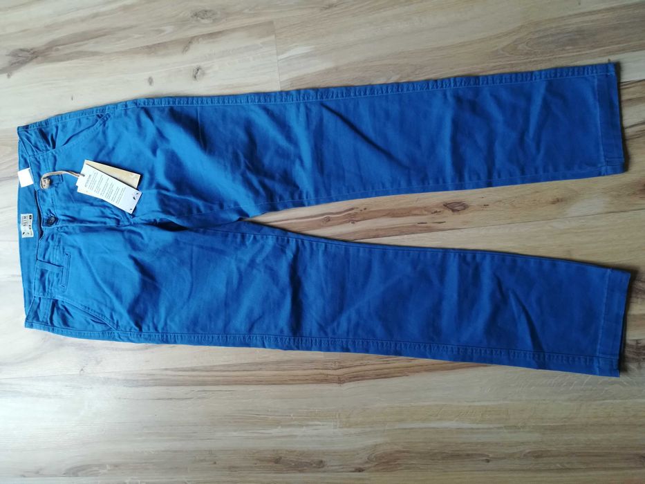 Niebieskie spodnie jeansy slim, rozmiar 28