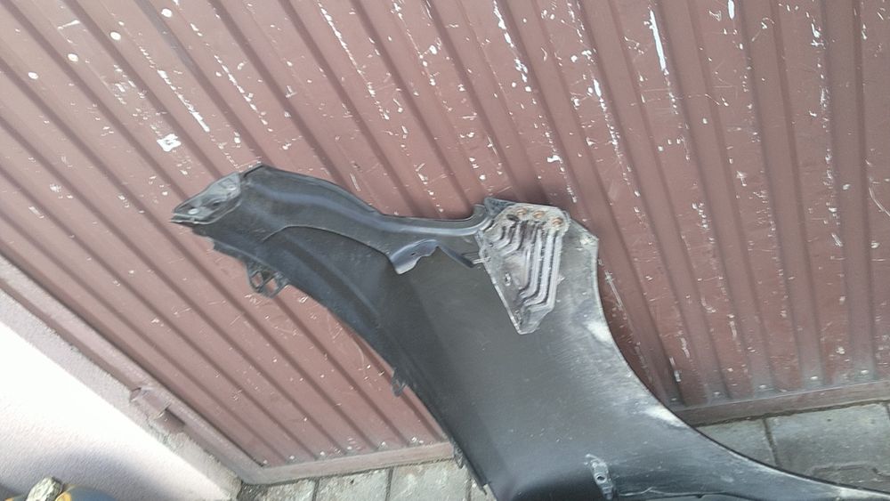 ) Lancia Ypsilon błotnik przedni lewy