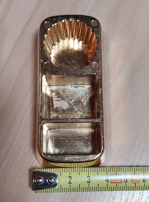 Abre cápsulas antigo em forma de barra de ouro