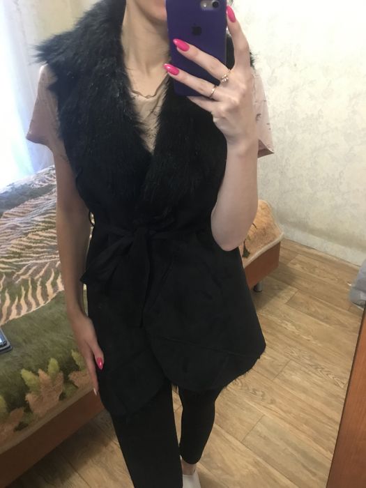 Жіноча жилетка