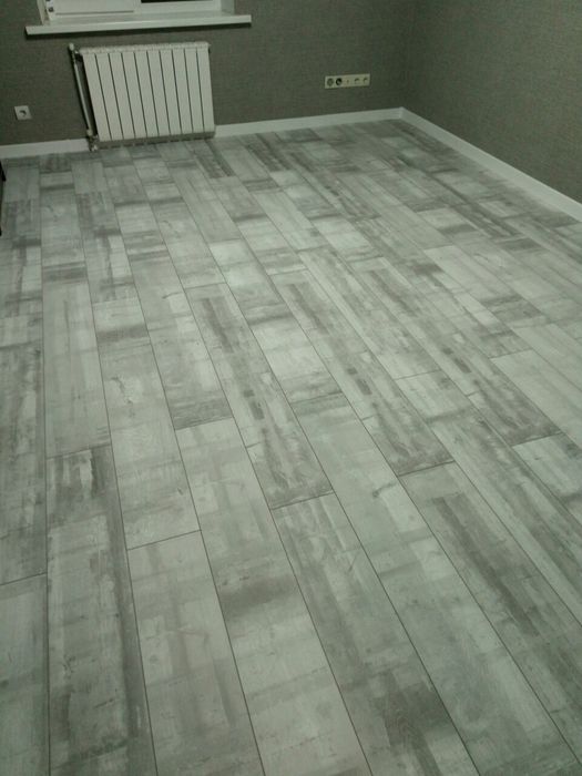 Укладка ламінату, паркетної дошки, вінілового покриття