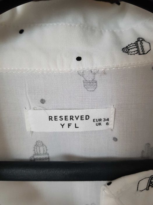 Biała koszula bez rękawów Reserved 34