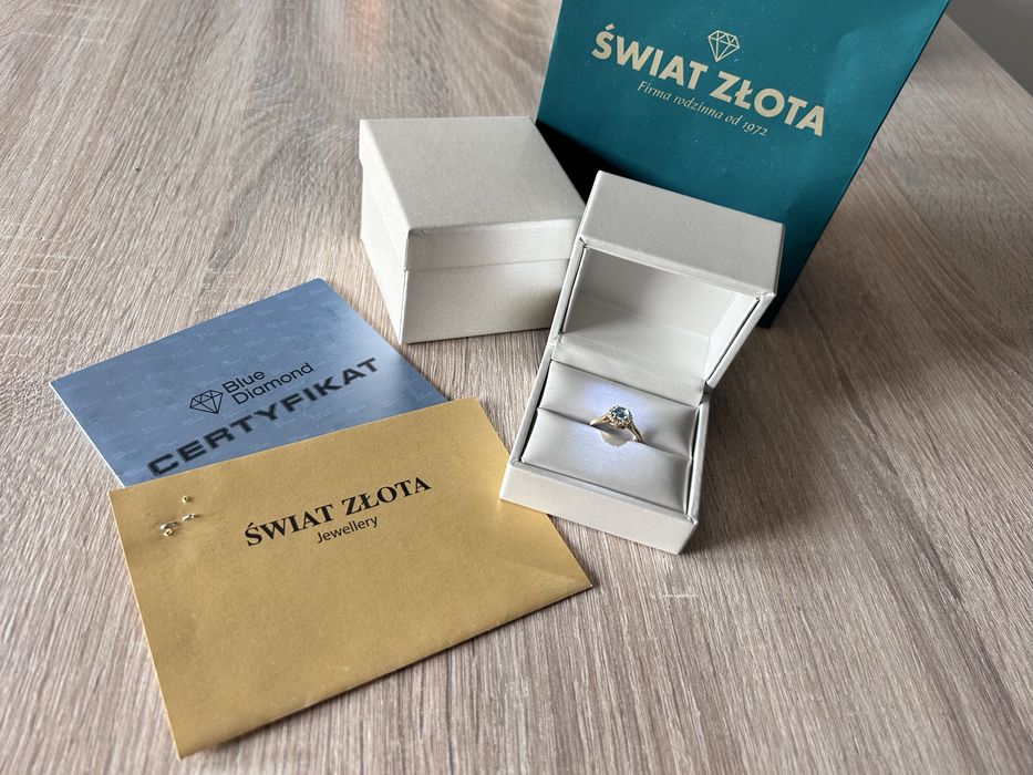 Złoty pierścionek idealny na zareczyny Błekitny topaz/diamenty