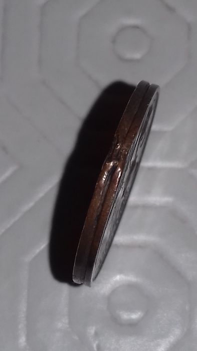 Moeda com defeito de impressão