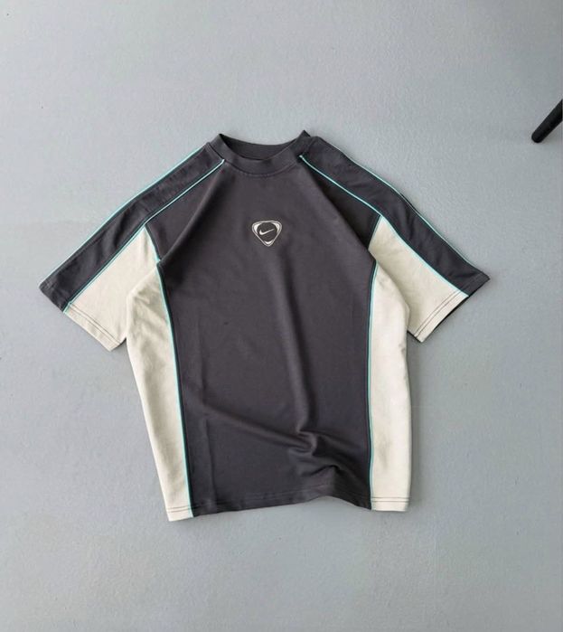 The Nike T-shirt is new and has never been worn.
