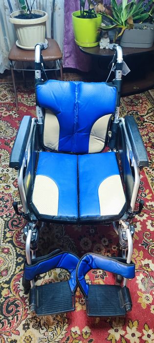 Коляска для человека с инвалидностю