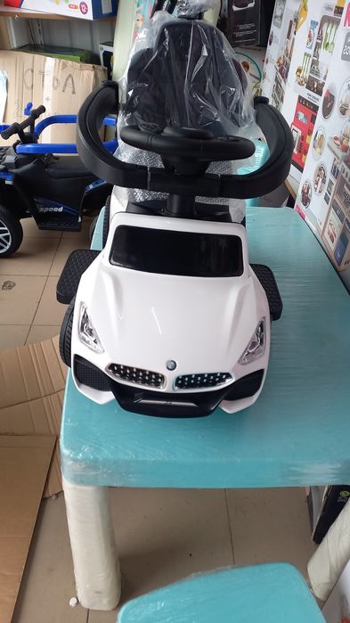 Толокар каталка гумові колеса,поворотна ручка,шкіра єко сидіння,муз.св