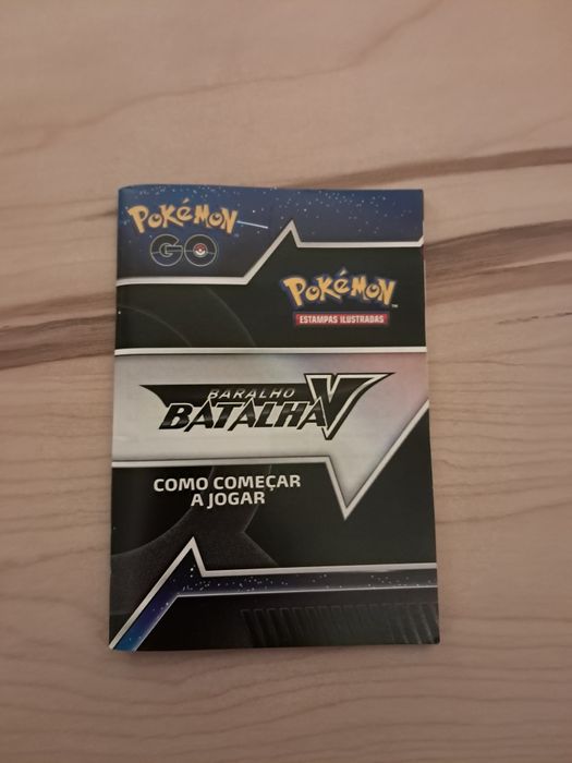 Moeda do mewtwo com manual de batalha e campo de batalha