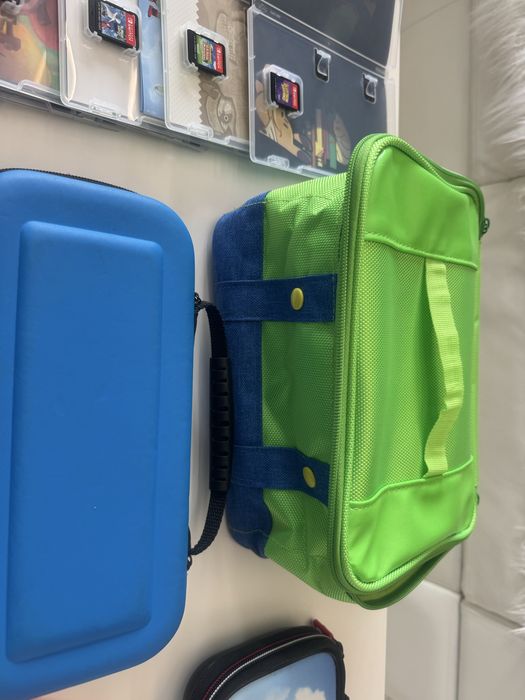 Nintendo switch zestaw ( 3xetui, 6 gier, dodatkowe pady, nakladki)