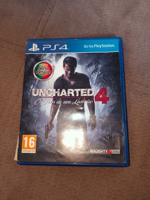 Uncharted 4 O Fim de um Ladrão em boas condições tirando a caixa que está um pouco rasgada de lado para, PlayStation 4