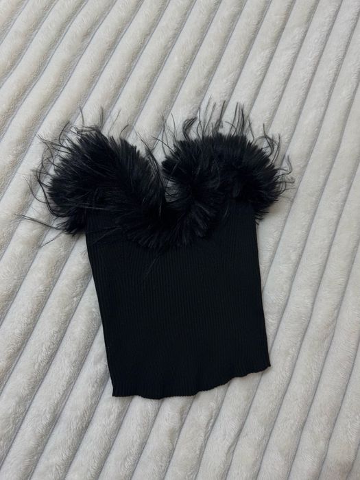 Топ  з  пірʼям