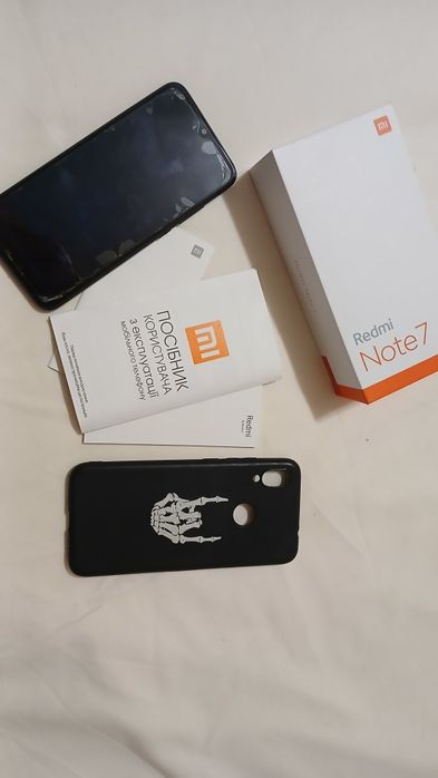 Телефон мобільний.