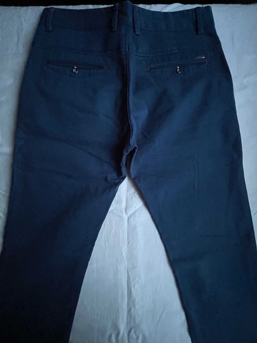 Granatowe męskie, młodzieżowe spodnie wizytowe W:30 L:34
