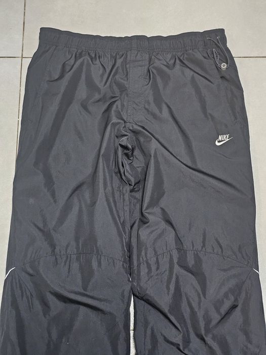 Nike Sportswear spodnie do biegania roz.M wodoodporne