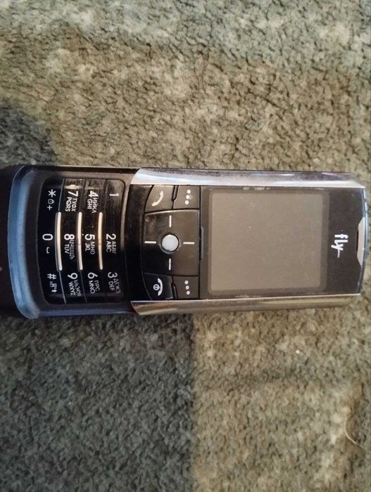Мобільний телефон Fly SL500i  слайдер
