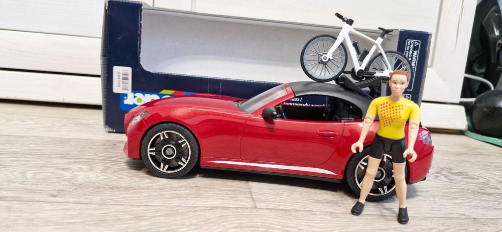 Іграшковий автомобіль "Roadster Bruder" з велосипедом та фігуркою