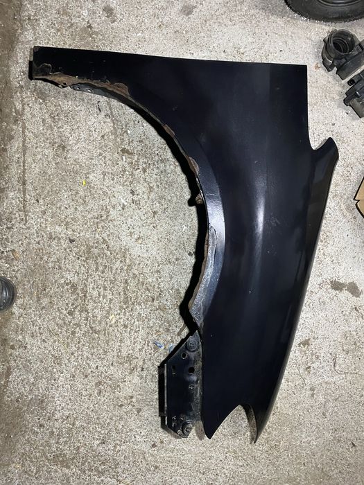 Błotnik przód prawy VW Touran lift 06-10r czarny