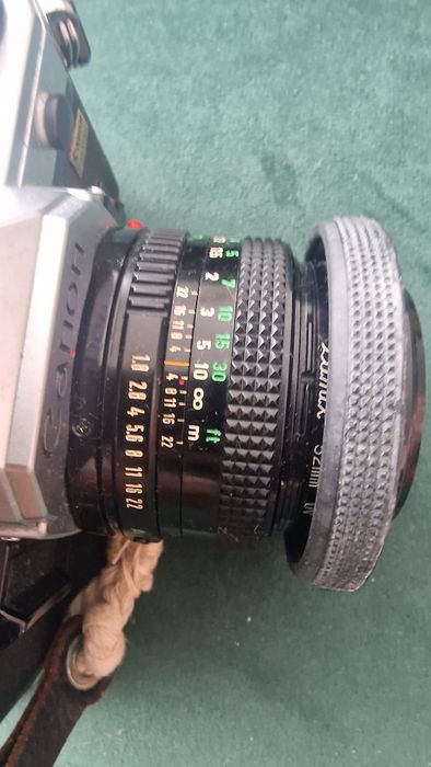 Canon AE-1 + Lente 50mm f/1.8 + Lente 135mm + Flash + Bolsa