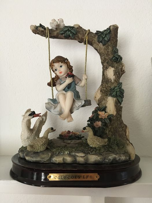 2 estatuetas em marfinite64861842173442121