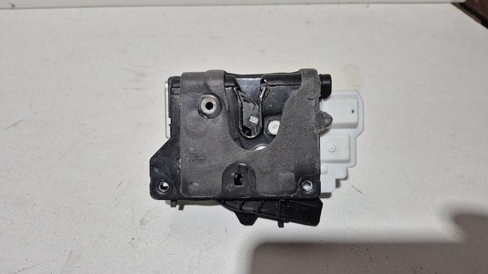 Zamek drzwi prawy przód nowy Land Rover GX6A 21812-GB