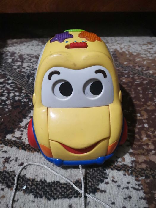 Детская машинка с глазками с грузовых открывающимися отсеком.