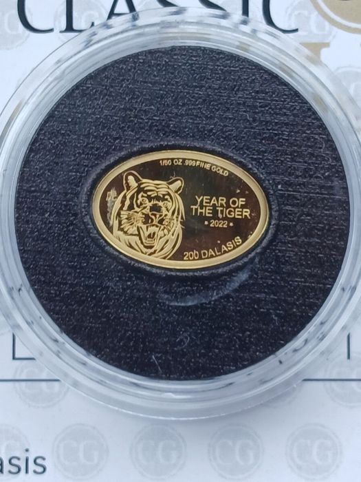 Золотая монета 999.9 пробы вес 0,622грамма