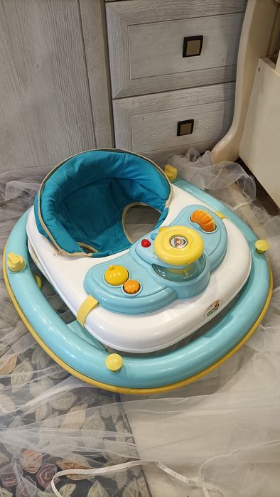 Продам музыкальные ходунки .