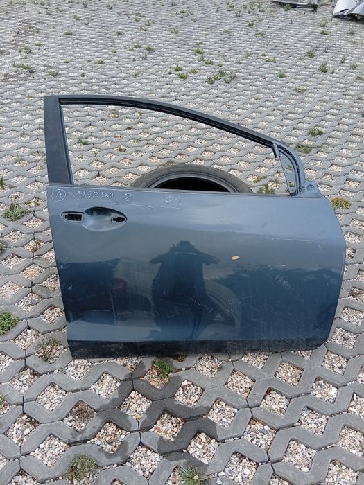Porta frente Dir Mazda 2 com toques