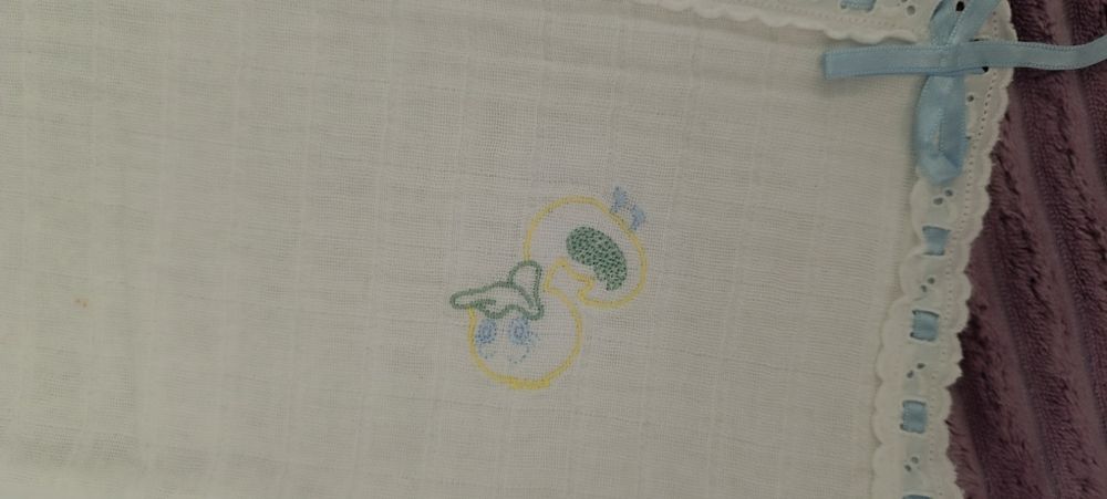 Embroidered diaper with satin ribbon. New