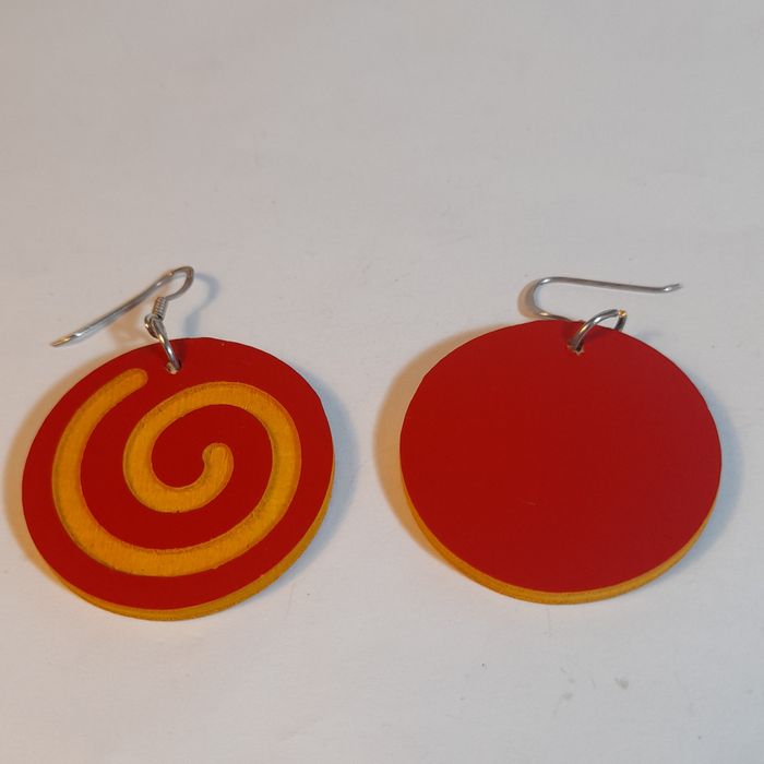 Wooden earrings in the shape of spirals.