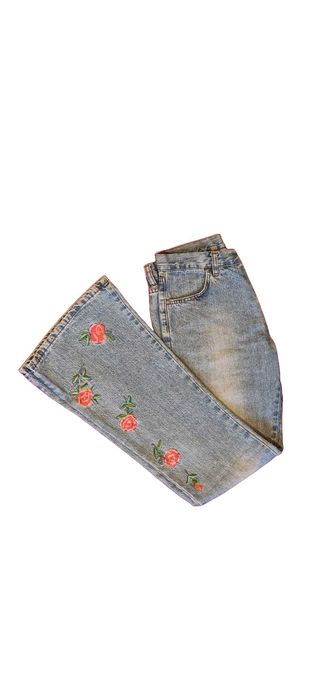 Light blue vintage style fitted bell-bottom jeans with flowers