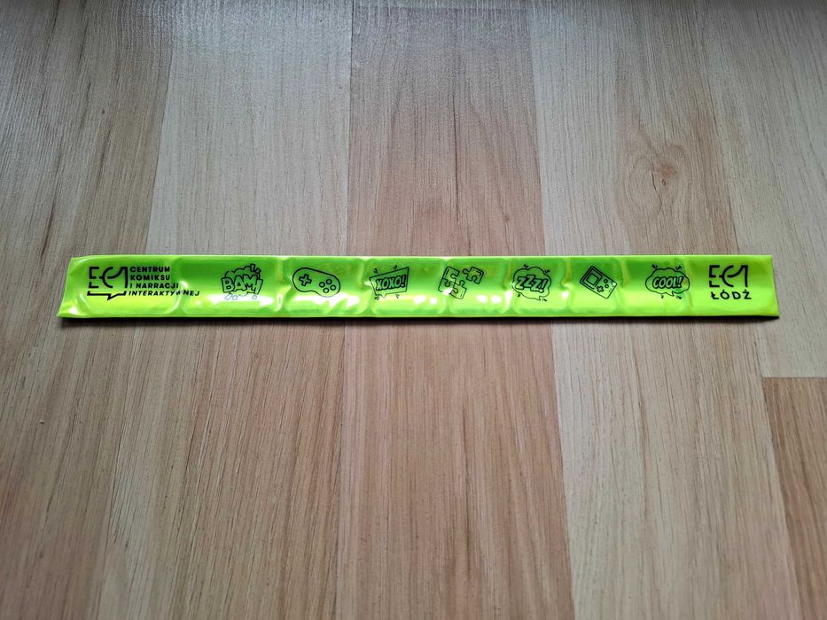 Opasko odblaskowa na rękę Centrum Komiksu i Narracji Interaktywnej