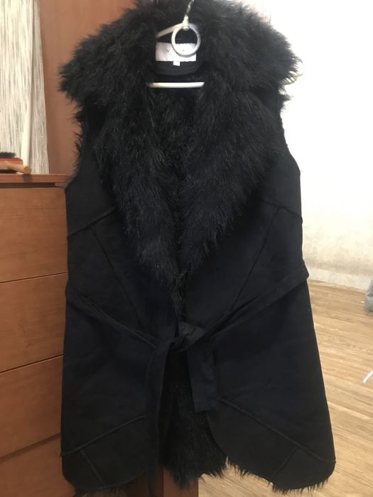 Жіноча жилетка