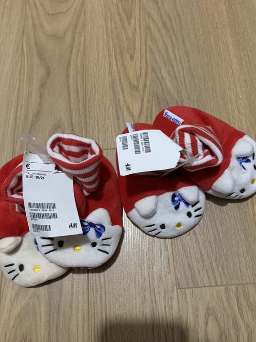 New, never-worn baby slippers with tag