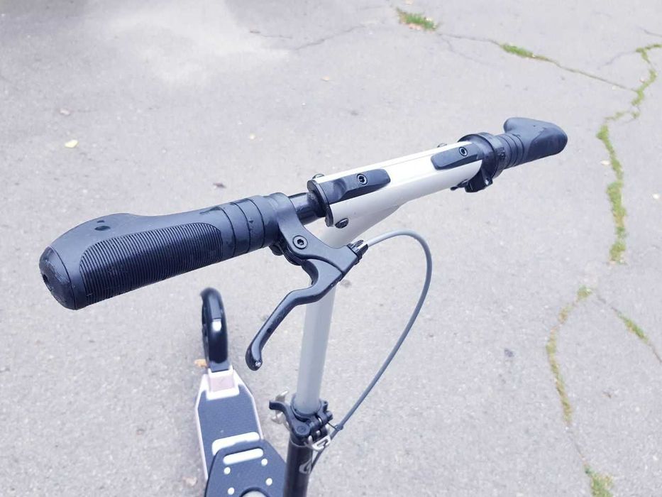 Продам самокат Оxelo для дорослих (в стані нового)