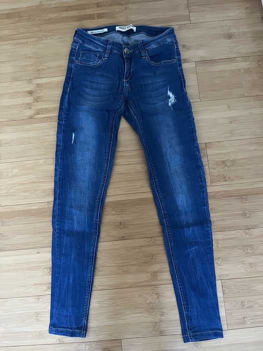 Spodnie jeansowe z przetarciami tally weijl 34