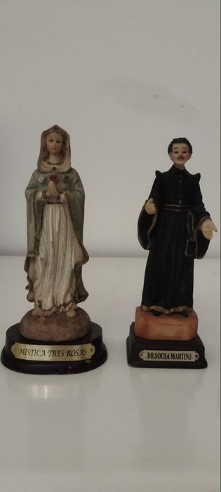 Santos...um deles em pedra e a nossa senhora com os pastorinhos  latão