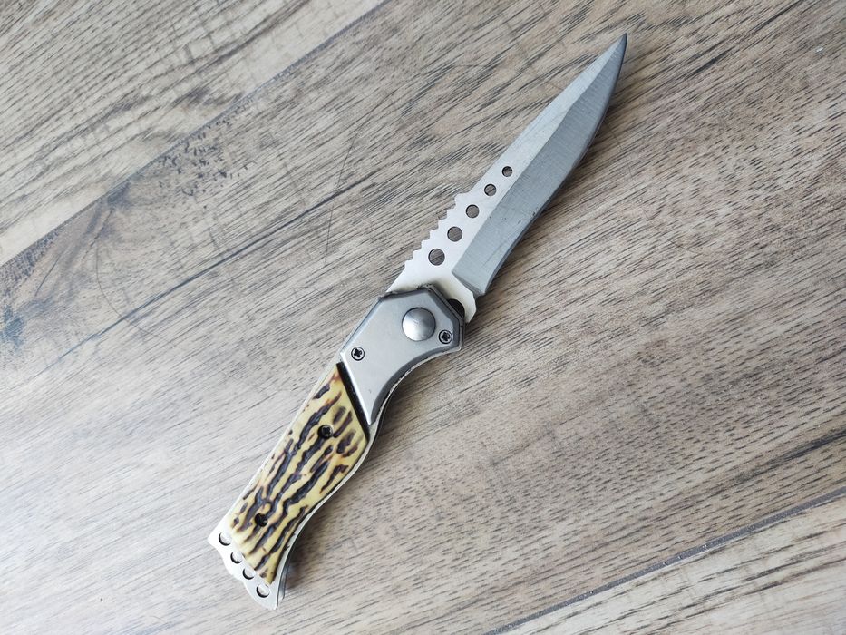Nóż sprężynowy, składany