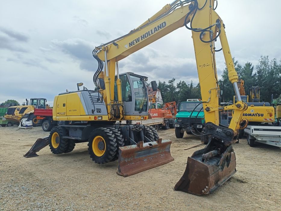 Maszyna budowlana koparka New Holland MH Plus  Ramie LONG