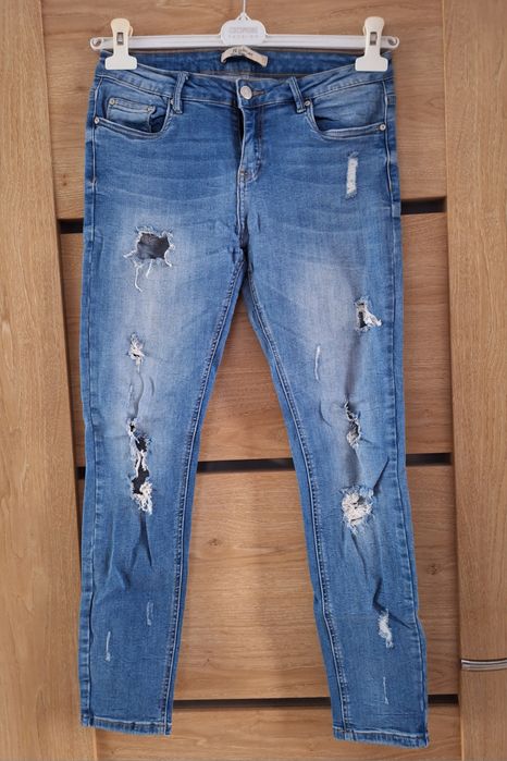 Niebieskie dżinsy z przetarciami dziurami rurki skinny biodrówki L 40 R.Display