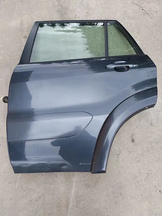 Drzwi lewe tył przód 1e0 toyota rav Ii 00-05