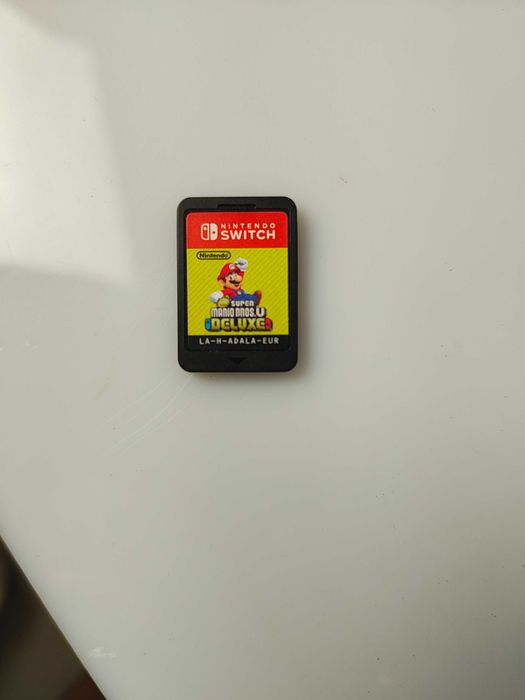 Konsola Nintendo Switch + etui + Super Mario Bross Delux bdb stan