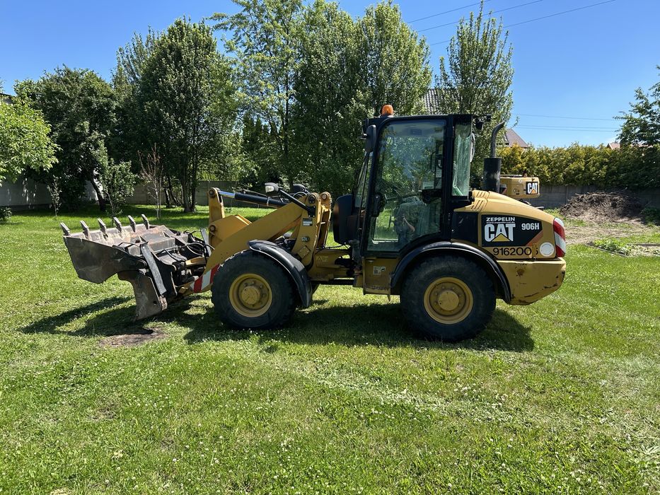 Caterpillar CAT 906H ładowarka z Niemiec + widły